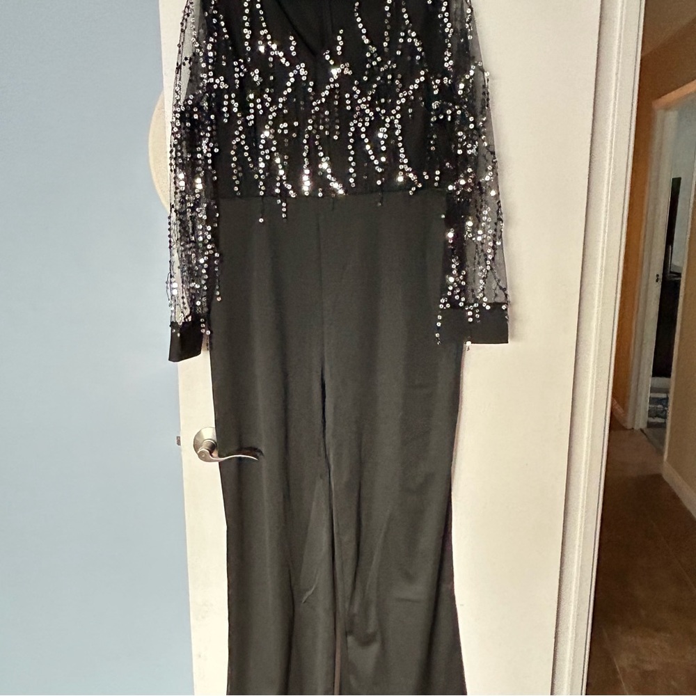 Women’s black jumpsuit with sequence zippered back new no tags